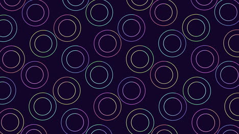 neon rainbow rings pattern in rows on black gradient