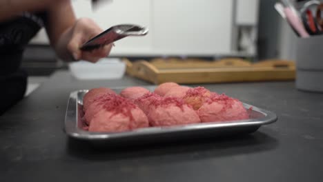 Grating-Strawberry-Chocolate-Bars-On-Top-Of-Strawberry-Cookie-Dough-Before-Baking