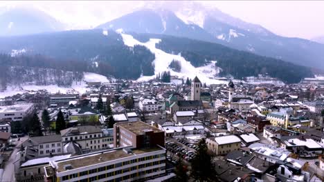 aerial view of the alpine town of san candido in italy.