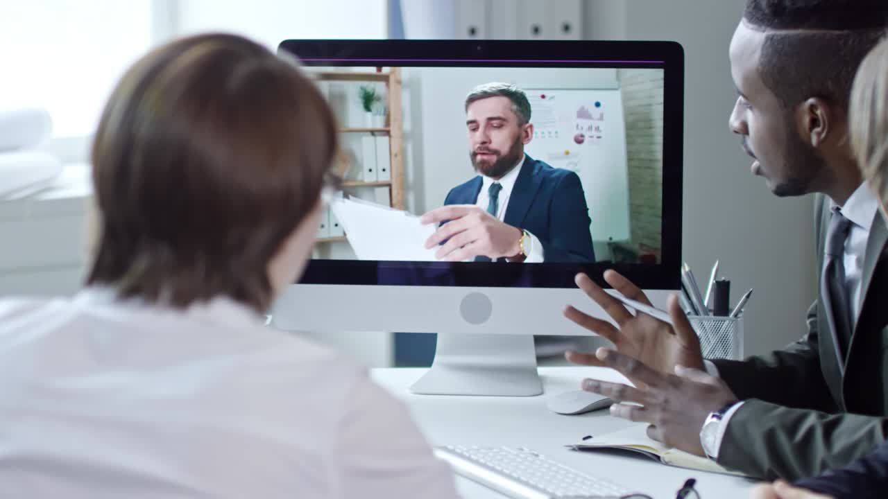 Diverse Business Team Web Conferencing with Colleague