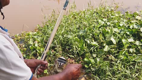 Fisherman-Reeling-in-His-Catch-in-The-River