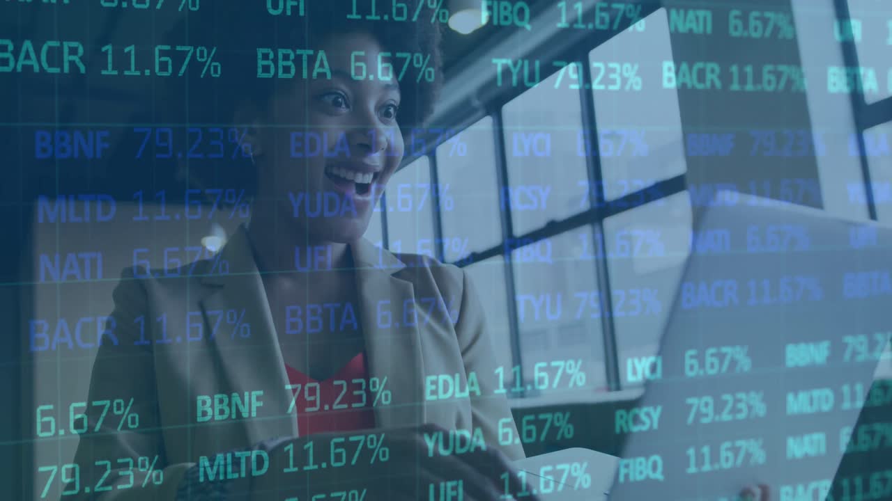 Animation of financial data processing over african american businesswoman using laptop in office