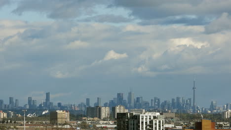 time lapse of the cityscape view of toronto, canada, with clouds moving in the wind