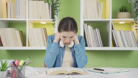 tired asian schoolgirl has neck pain, pain.