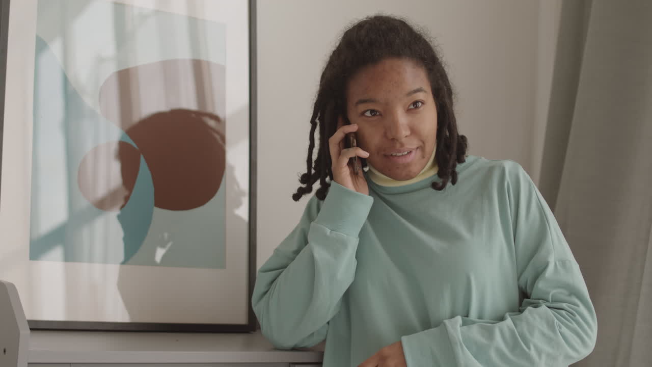 Cheerful Young Woman Making Telephone Call