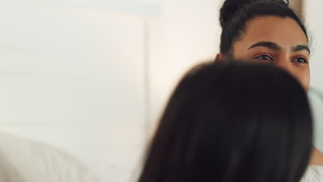 a happy, young indian couple sleep in bed