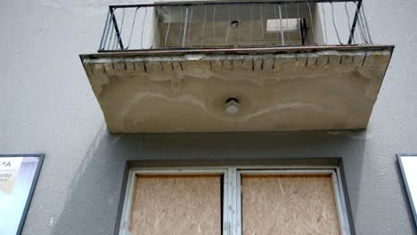 broken window glass of a building in the old soviet border post between austria and czech republic - tilt up