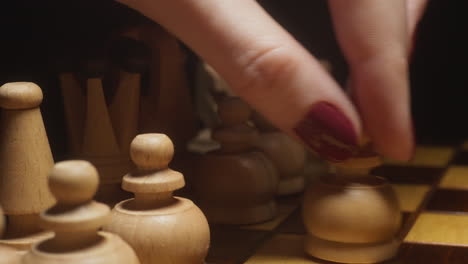 wooden chess pieces on a chessboard