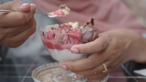 woman enjoying a delicious ice cream dessert