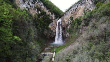 an areal shoot of a beautiful waterfall in bosnia and herzegovina, with a slightly tilt in the camera