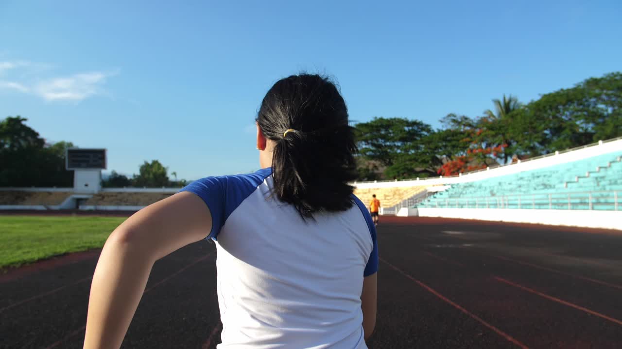 Girl Running At Stadium