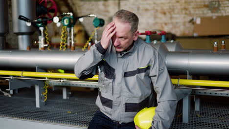 tired man at the factory