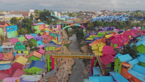 Reveal-shot-of-rainbow-village-jodipan-malang-Indonesia,-aerial