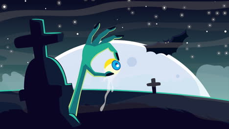 spooky zombie hand holding an eye in a graveyard at night