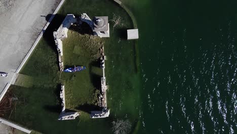 A-paddleboarder-explores-the-sunken-ruins-of-the-St