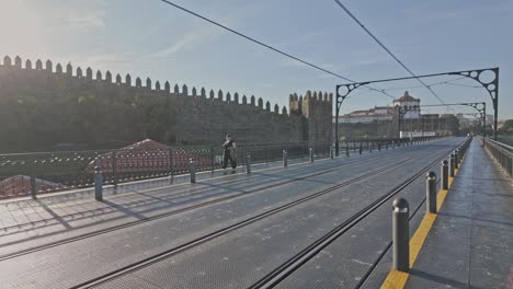 scenic view of porto's waterfront from the iconic dom luís i bridge in the morning light