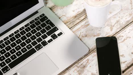 Laptop,-smartphone,-cup-of-coffee-and-pot-plant