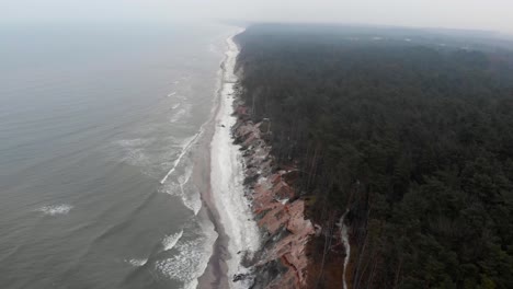 Aerial-shot-of-sandy-beach-in-Ustka-in-winter