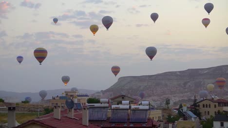 balloons flying above goreme in cappadocia