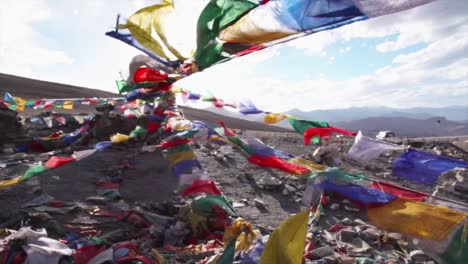 prayer flags blowing in the wind in the himalaya mountains in india.