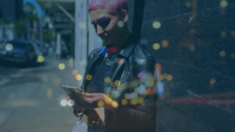 Woman-using-smartphone-and-cityscape