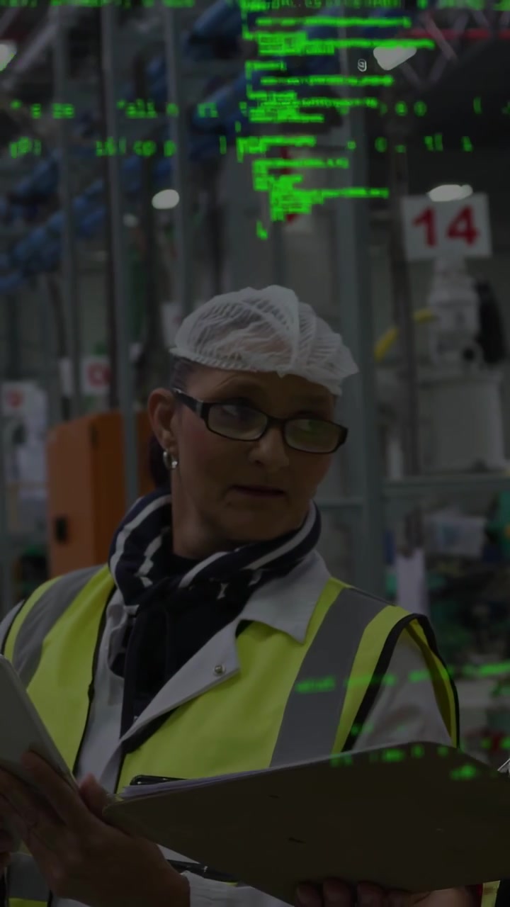 Vertical video: QA mgr checking tablet heeding gesture doing QC as green overlay drifting aisle 14