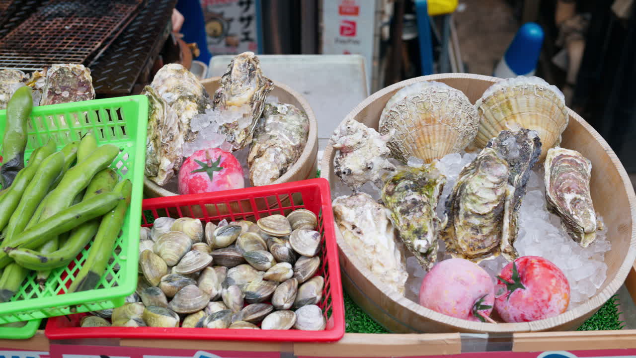 Different types of seashells on ice at the Tsukiji Fish Market in Japan