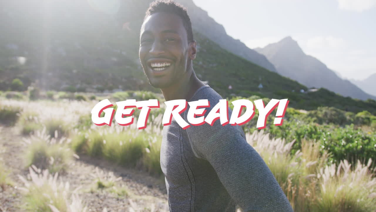 Animation of the words get ready in white over happy man hiking in mountains