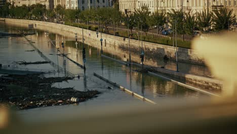 city river flooded, debris and damage