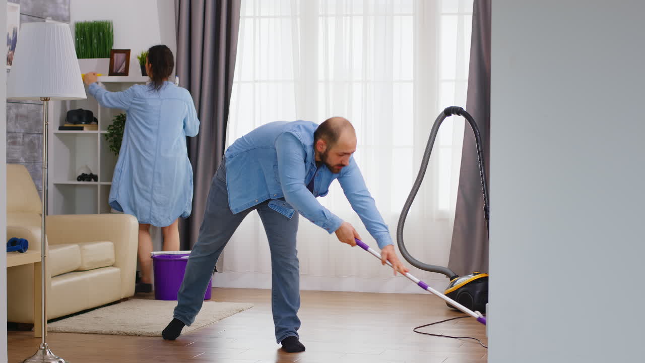 Man mopping the floor
