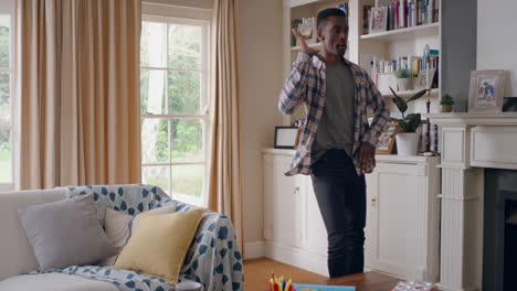 happy-african-american-man-dancing-at-home-celebrating-success-having-fun-crazy-dance-in-living-room-enjoying-lifestyle-freedom-on-weekend-4k