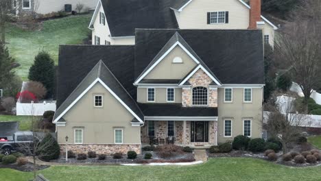aerial establishing shot of a suburban american house
