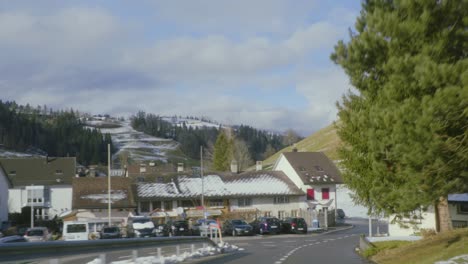 Driver-POV-driving-into-Fischenthal,-Fistel-Switzerland,-car-POV-beautiful-sunny-day