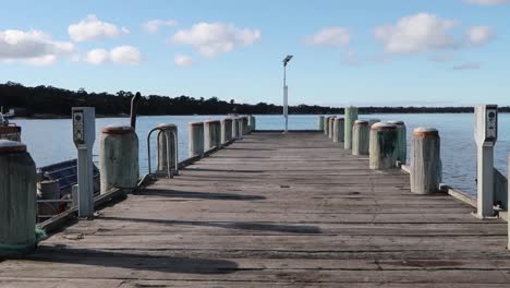 a view down a island jetty with the pretty sea in the back ground