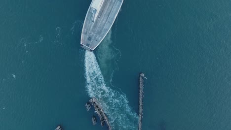 top down aerial drone shot of ferry departing shelter island north fork long island new york before sunrise