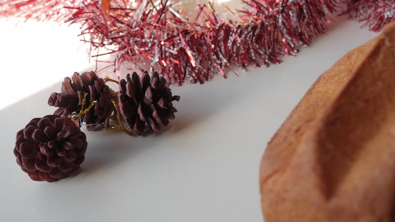 Festive pinecones and panettone with Christmas decor on a cozy table