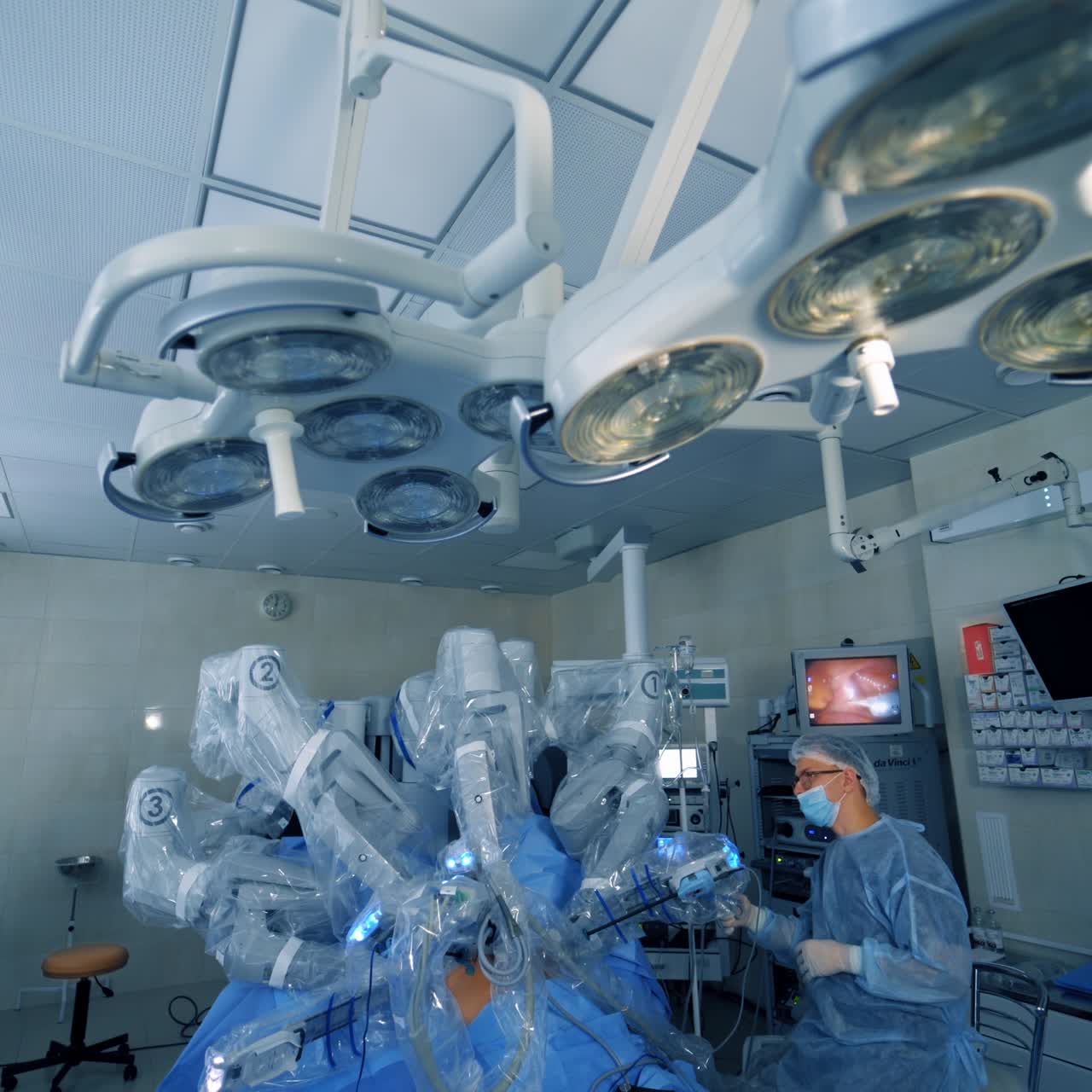 Surgical room in hospital with robotic technology equipment. Minimally invasive surgical innovation, medical robot surgery with 3D view endoscopy