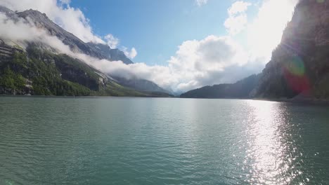 Aerial-flight-over-a-beautiful-big-Oeschinen-lake-on-a-mountain-in-Switzerland