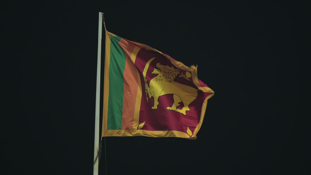 The Sri Lankan flag waving proudly in the night breeze