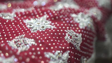 focus pull shot of traditional bridal wedding sari, traditional dress for bride at wedding ceremony