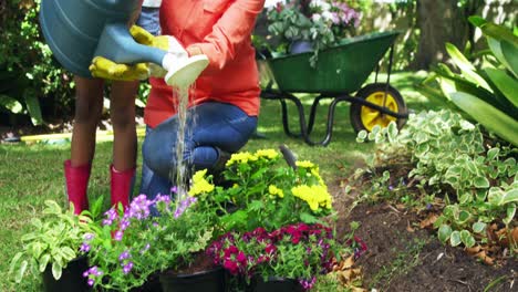 Grandmother-and-grand-daughter-watering-plants