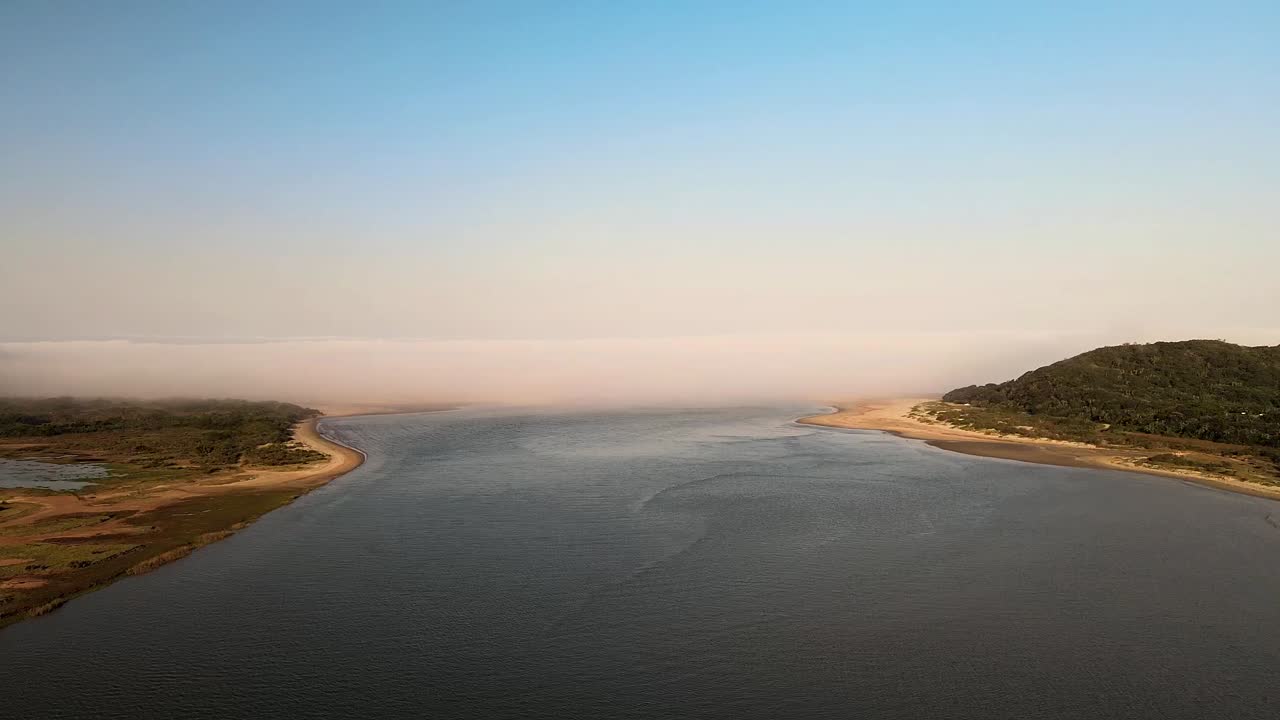 Stunning misty lagoon entering the sea at Kei Mouth - South Africa, aerial view. Serene, ethereal beauty