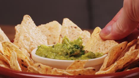 enjoying guacamole with tortilla chips