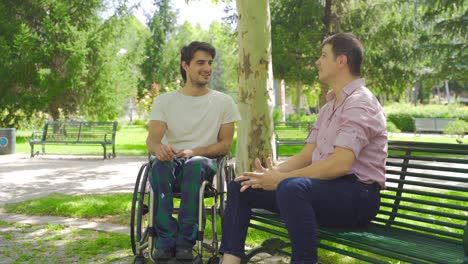 disabled youth sitting in a wheelchair chatting.