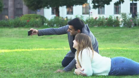 couple taking selfie in a park