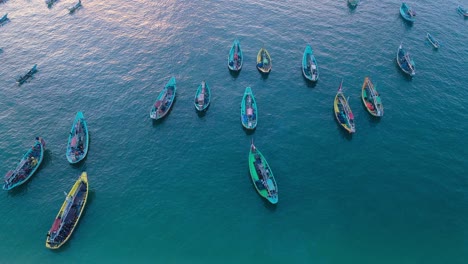 indonesia traditional fishing boats docked in shores after fishing an aerial view, papuma beach jember