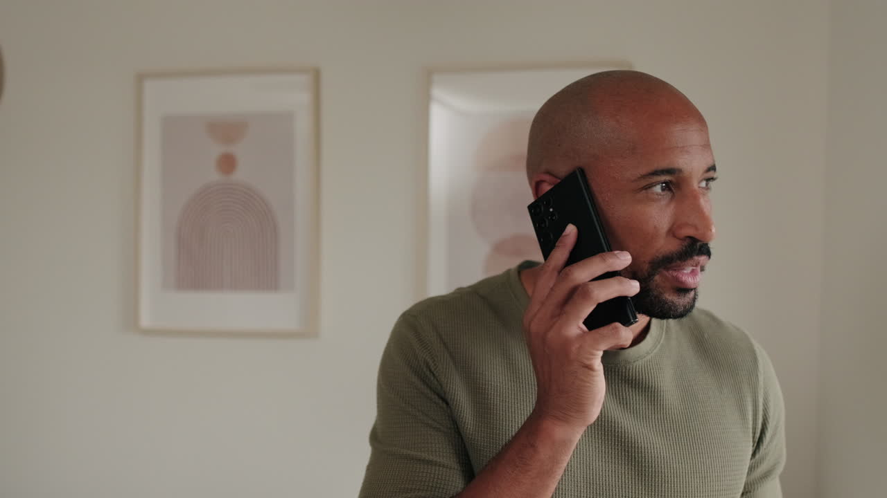 Man Talking on Phone at Home