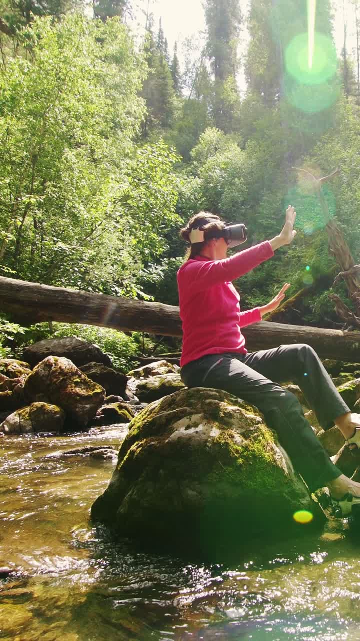 Woman experiencing virtual reality in a forest near a river