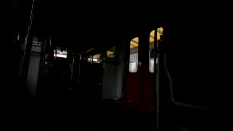 Door-Closed-As-The-Passenger-Enter-Inside-Dark-Train-Carriage