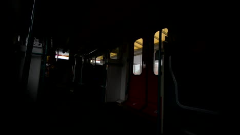 door closed as the passenger enter inside dark train carriage